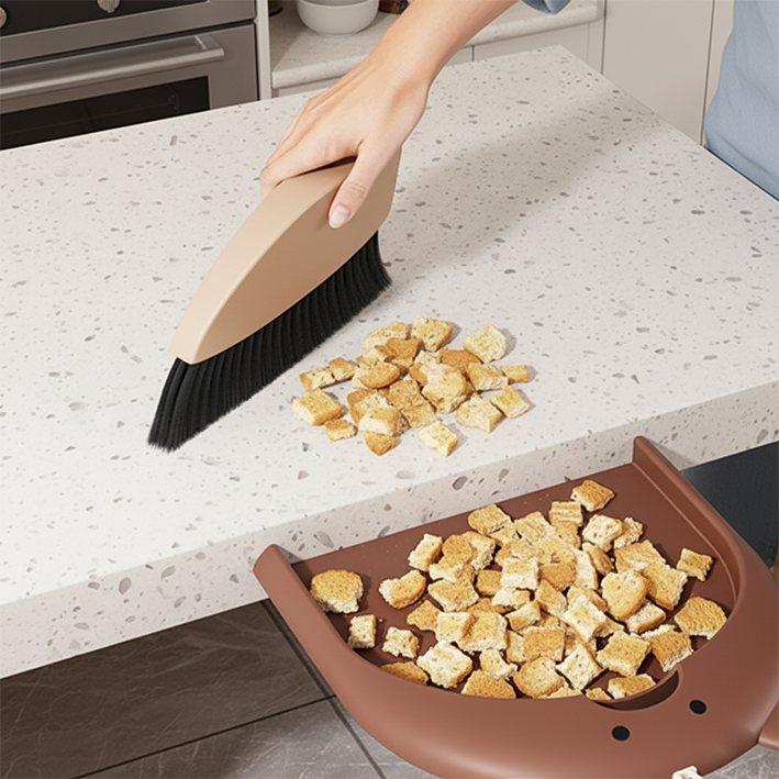 balayette qui ramasse les miettes de pains