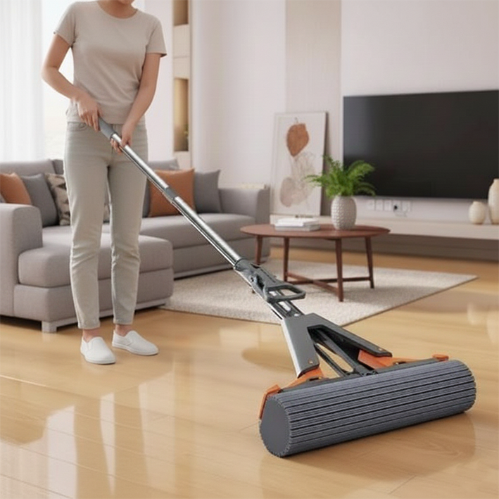 femme nettoie avec balai à laver le sol en parquet