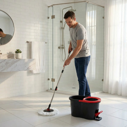 homme nettoie avec seau-et-serpillère la salle de bain