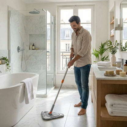 homme avec serpillère microfibre nettoie la salle de bain