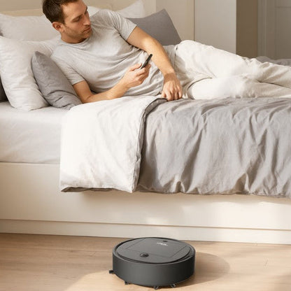 robot aspirateur laveur 3 en 1 homme relaxe lit