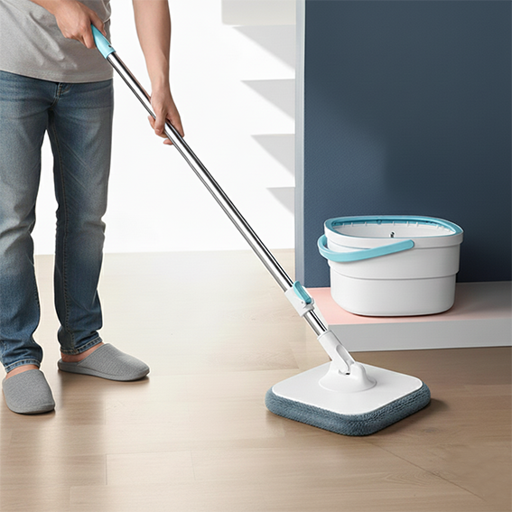 seau et serpillère homme nettoie le parquet